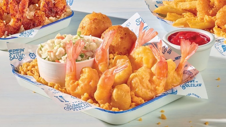 Tray of Long John Silver's Hand-Battered Shrimp with hush puppies and cup of coleslaw
