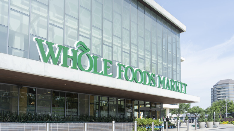 The Whole Foods logo on a store building