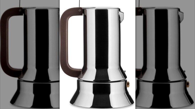 A silver Alessi 9090 with a copper-colored handle