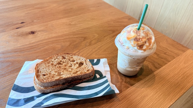 Crispy Grilled Cheese and Caramel Ribbon Crunch Frappuccino on table