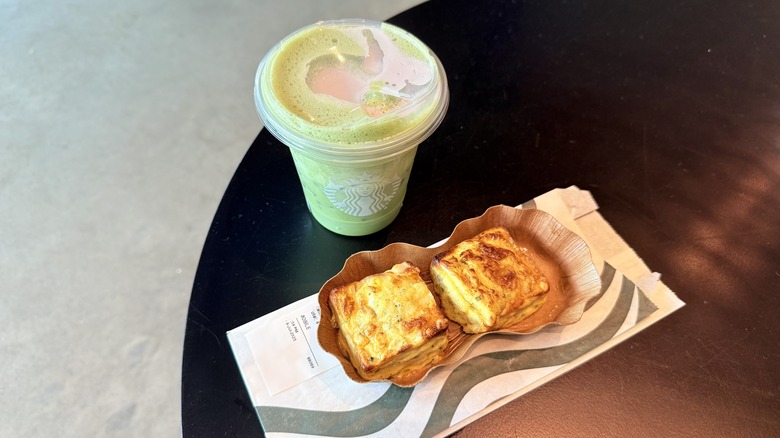 Potato Cheddar & Chive Bakes and Iced Lavender Cream Oatmilk Matcha on table