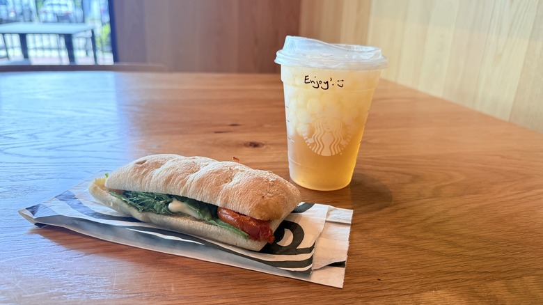 Tomato & Mozzarella on Focaccia and Iced Peach Green Tea Lemonade on table