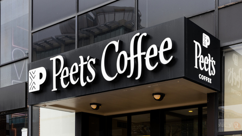 Black Peet's Coffee on side of glass building