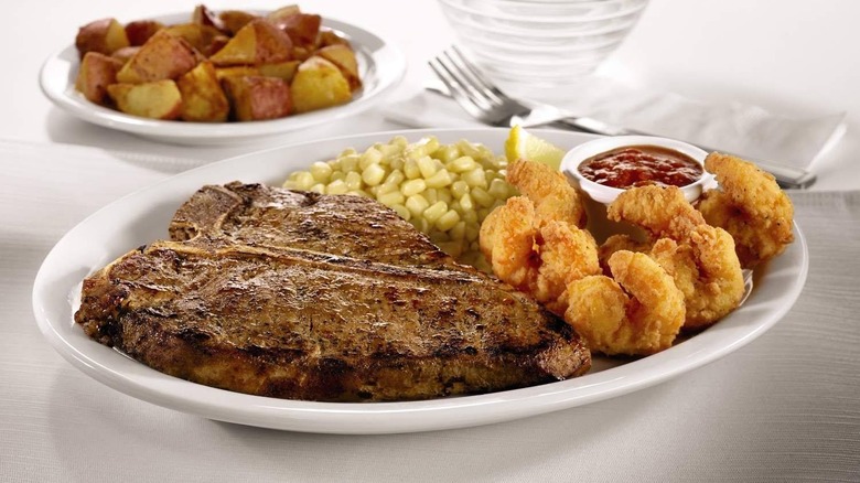 Denny's steak and shrimp on white plate
