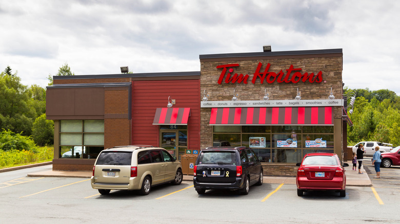 The outside of a Tim Hortons Restaurant on a cloudy day