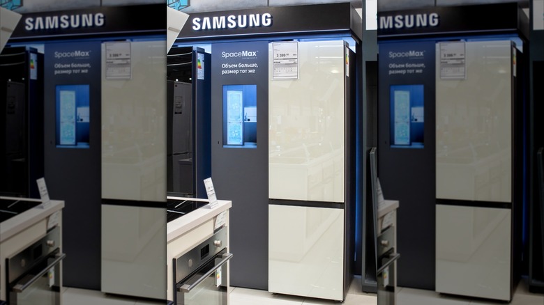 Mirrored image of Samsung refrigerator on display in an electronics store.