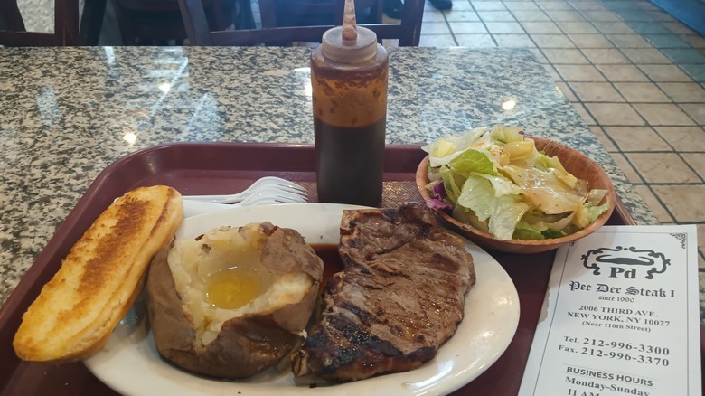 sirloin steak special with baked potato on tray from Pee Dee Steak House