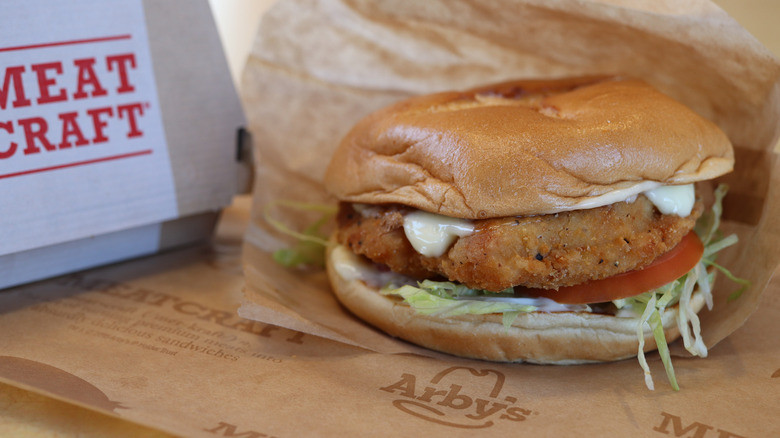 Arby's Crispy Chicken Sandwich on branded parchment paper