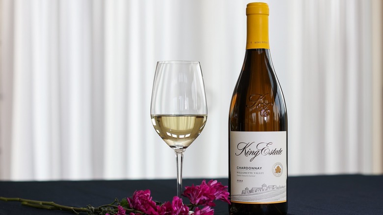 A bottle and glass of King Estate Chardonnay white wine