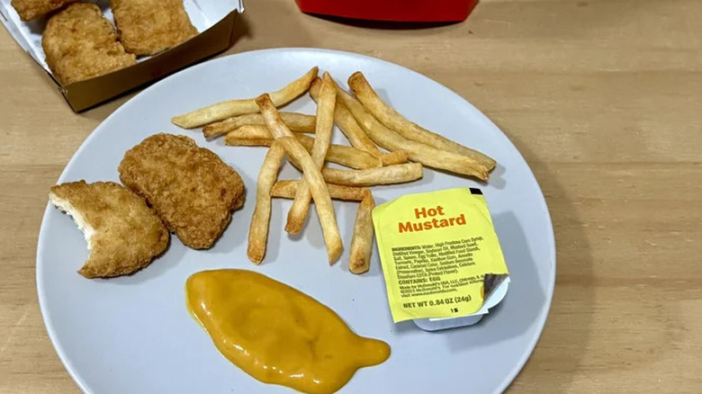 Plate with fries, nuggets, and Hot Mustard sauce