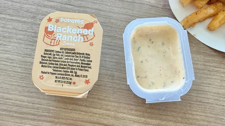 Top view of Popeyes Blackened Ranch Sauce packet