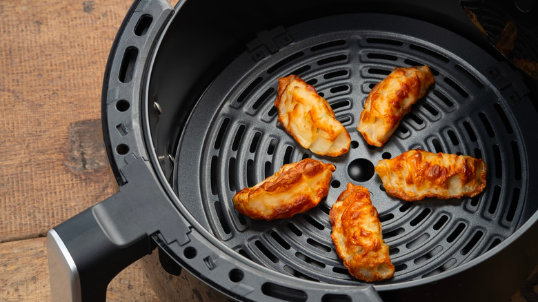 gyozas in an air fryer basket