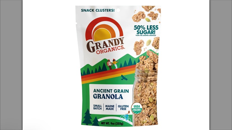 Bag of Grandy Organics Ancient Grain Granola with image of granola in jar and people hiking and cycling