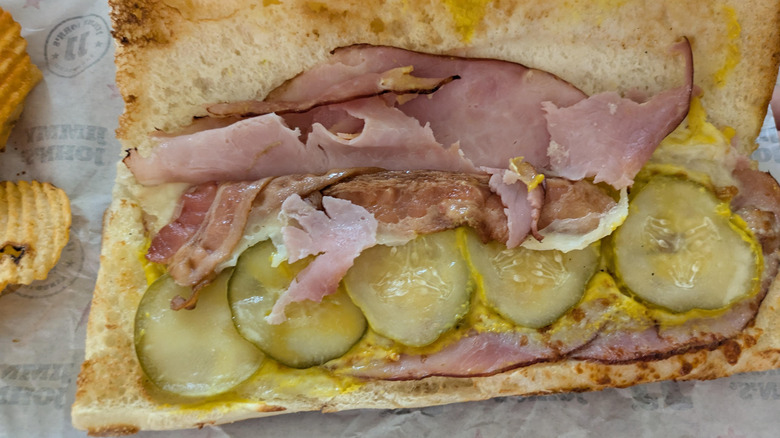 close up of open Jimmy Cubano sandwich on packaging