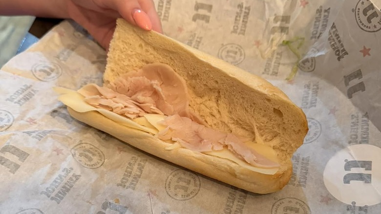 Close up shot of Jimmy John sandwich, drink, and chips