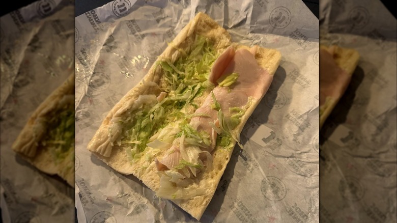 open Turkey Tom sandwich on packaging, mirrored image