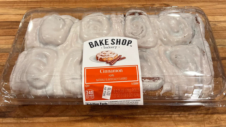 Packet of Bake Shop Aldi cinnamon rolls on wooden surface