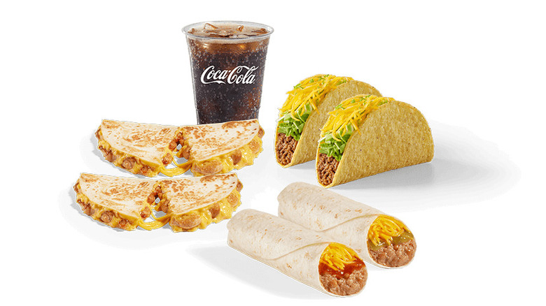Tacos, burritos, quesadillas, and cup of Coca-Cola from Del Taco on white background