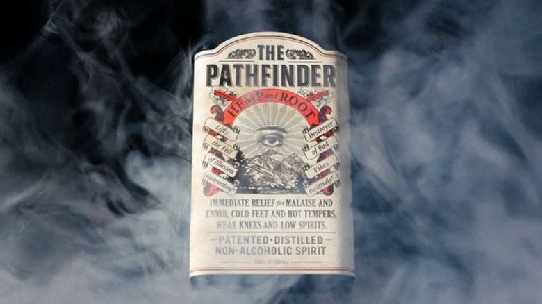 Close up of The Pathfinder bottle label behind smoke.