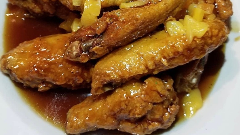 Peach wings on white plate