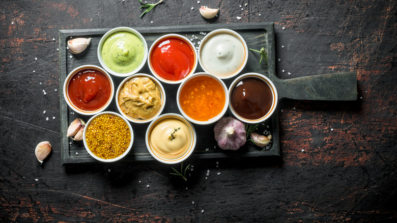 several ramekins filled with condiments