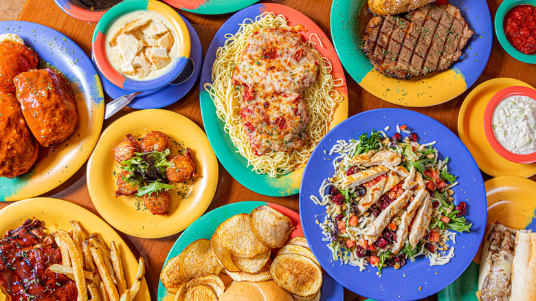 several large plates of food on a table