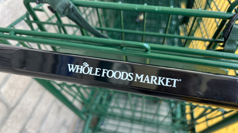 Whole Foods Market shopping cart with logo on handle