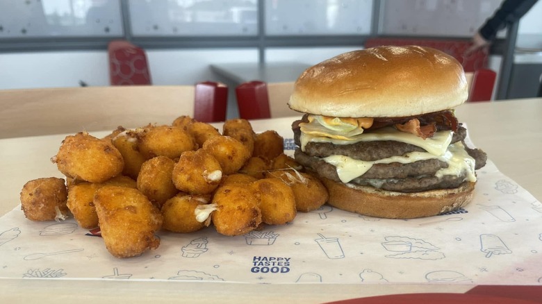 Dairy Queen Flamethrower Stackburger on paper with cheese curds