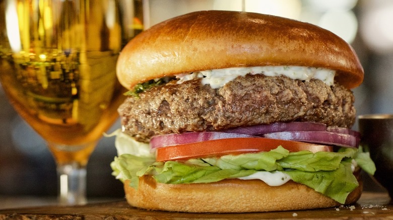 Fogo de Chao bar burger with a beer