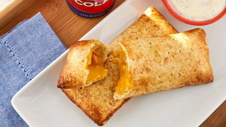 Ham and cheese filled pocket-style sand which on a plate