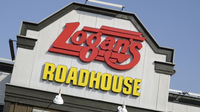 Slightly tilted view of Logan's Roadhouse sign on building