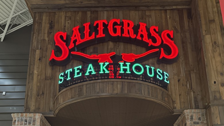 Entrance to Saltgrass Steakhouse with sign above door