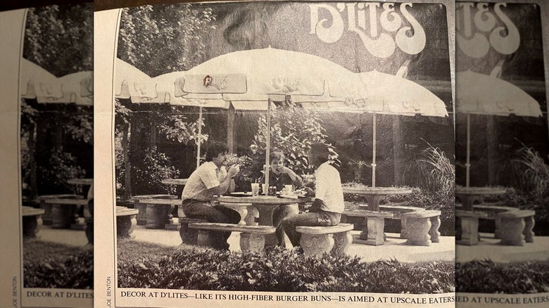 Old newspaper clipping showing people eating under an umbrella at a D'Lites resturant