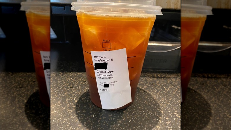 Picture of Starbucks drink on counter with a label stating its Cold Brew with added lemonade