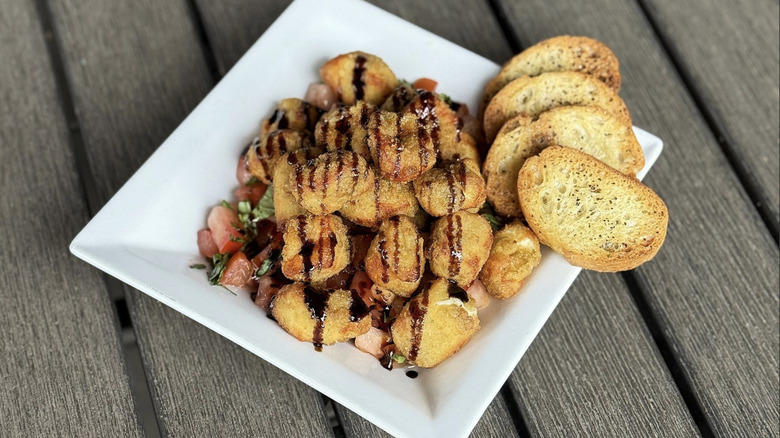 Caprese Curds on wooden table.