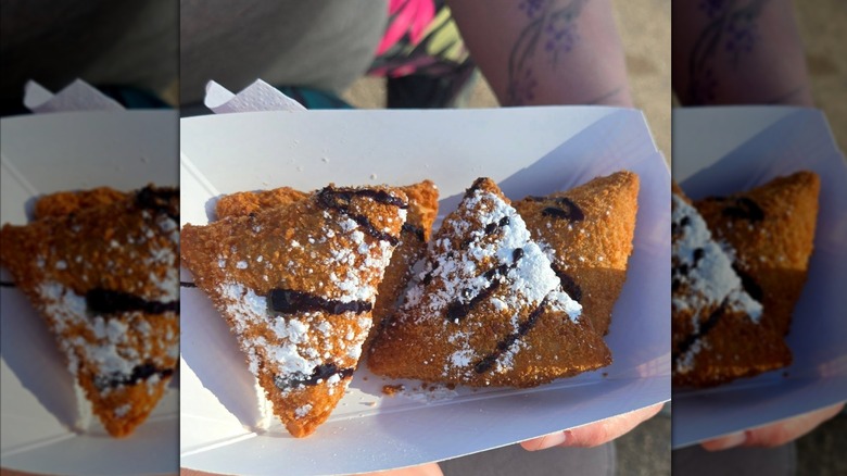 Deep-fried s'mores in white tray.
