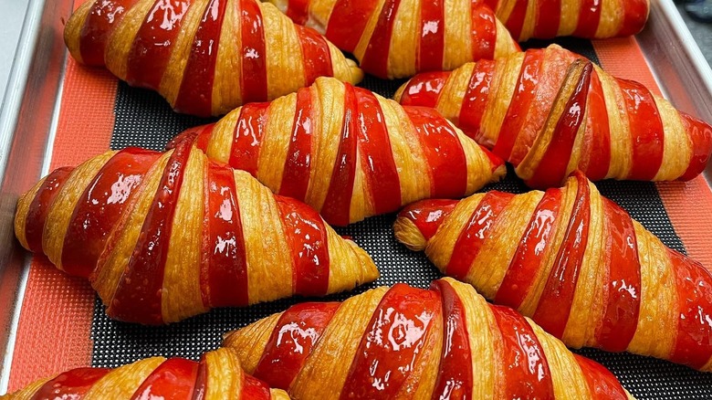 trays of red striped croissants at Diotima Bakehouse