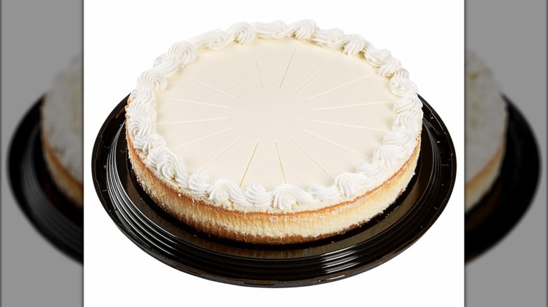 Full cheesecake on a white background