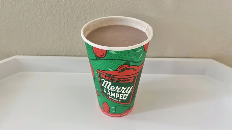 Flavored hot cocoa in a cup on a white counter