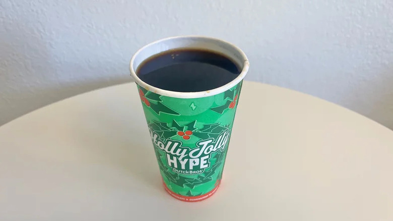 View of the toasted cold brew in a festive green paper cup from Dutch Bros