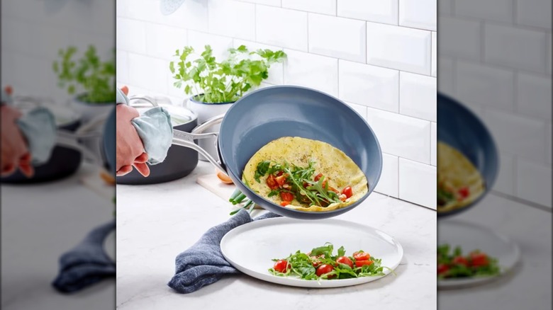 GreenPan Paris Pro pan with a cooked egg and veggies next to a plate