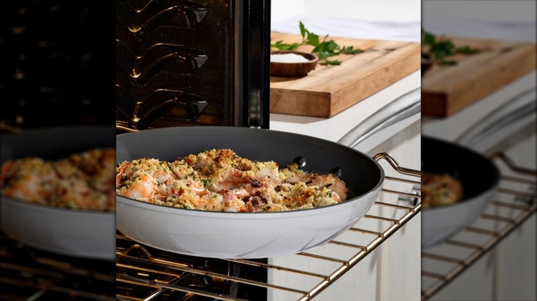 T-fal ceramic non-stick frying pan on an oven rack with cooked food