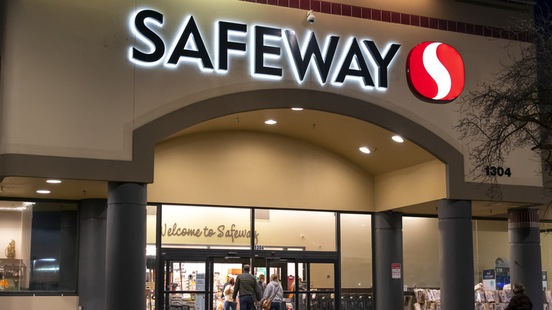 The exterior of a Safeway location at dusk.