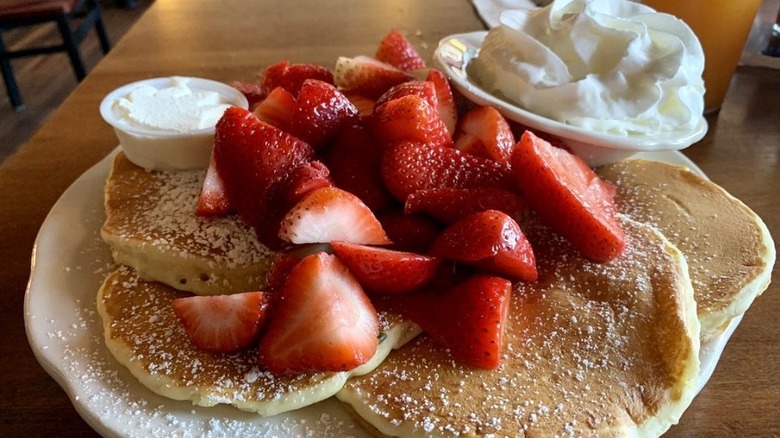 Pancake pancakes with strawberries and whipped cream from Original Pancake House