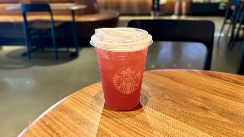 Starbucks Iced Passion Tango Tea Lemonade on a table served in a plastic cup