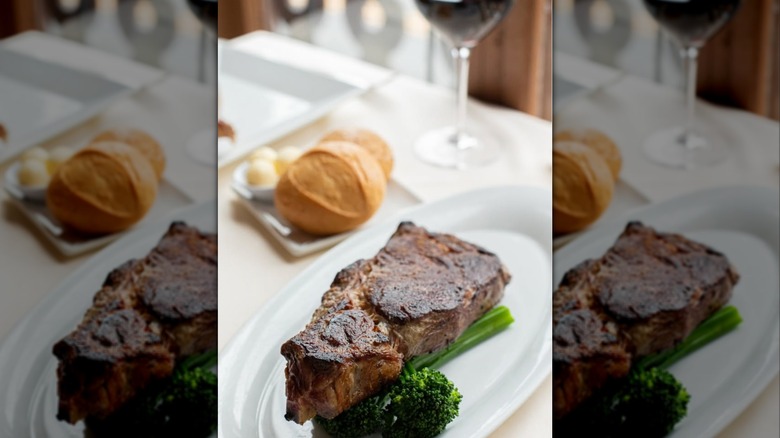 steak, bread, and wine on a table at the Knife and Fork Inn in New Jersey
