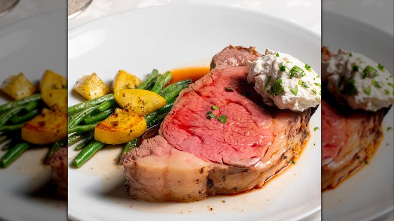 roasted prime rib from Rare, The Steakhouse with butter, chives, potatoes, and green beans