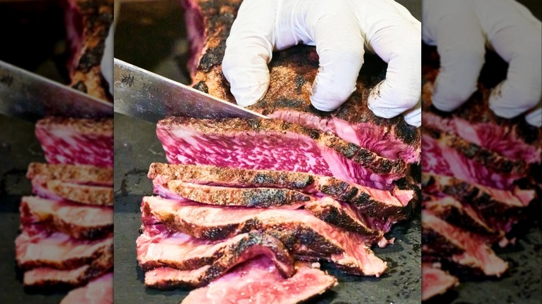 chef slicing a cut of steak at Stage Left Steak in New Jersey