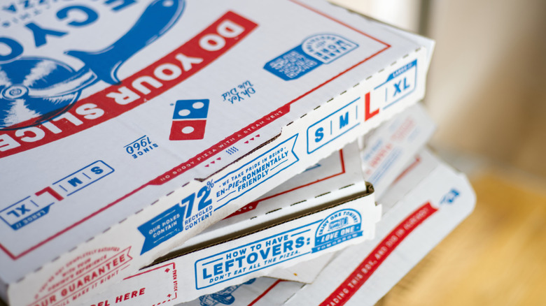 Domino's pizza boxes stacked