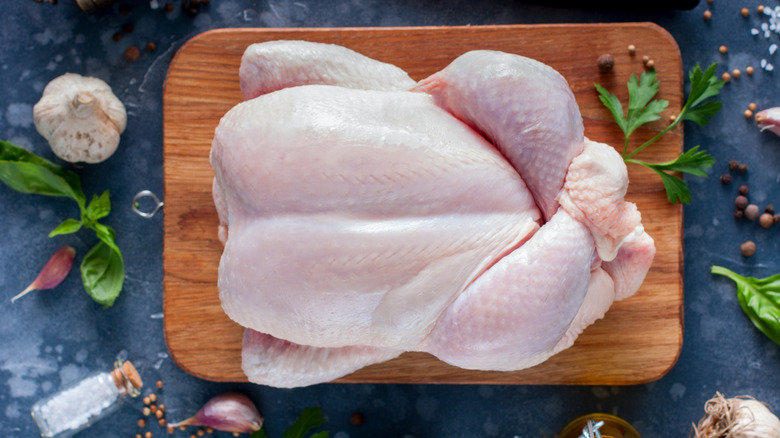 Top-down shot of a raw turkey on a cutting board